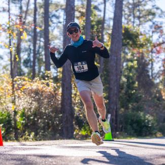 Person running a race on Alabama's Beaches